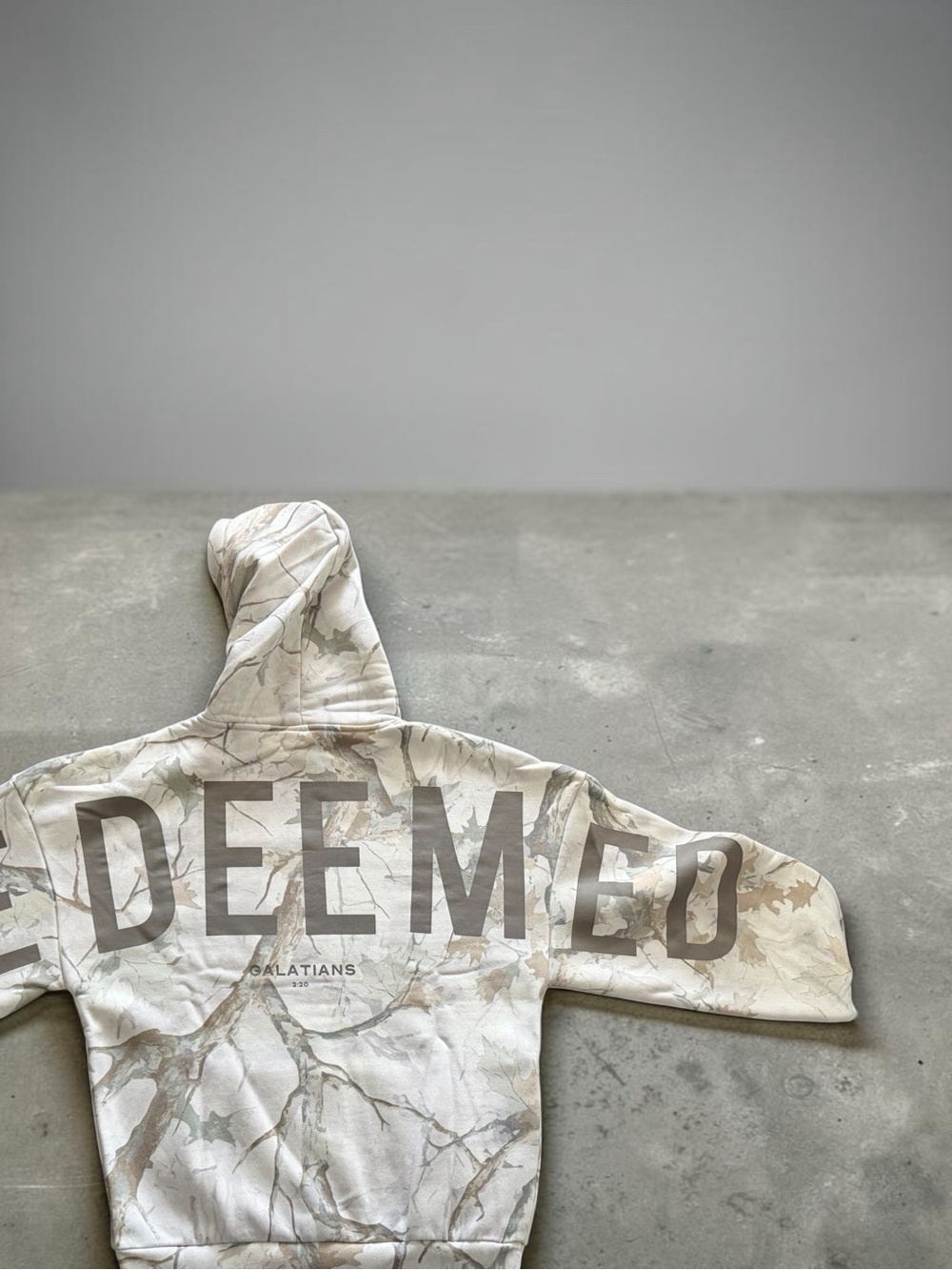GLO camouflage hoodie with REDEEMED Script on back size Small